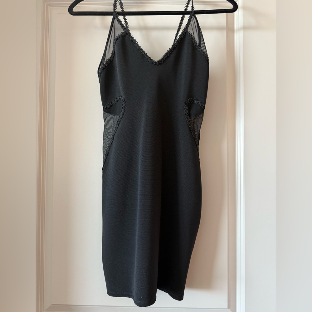 Black mini dress with mess side details. Size 2